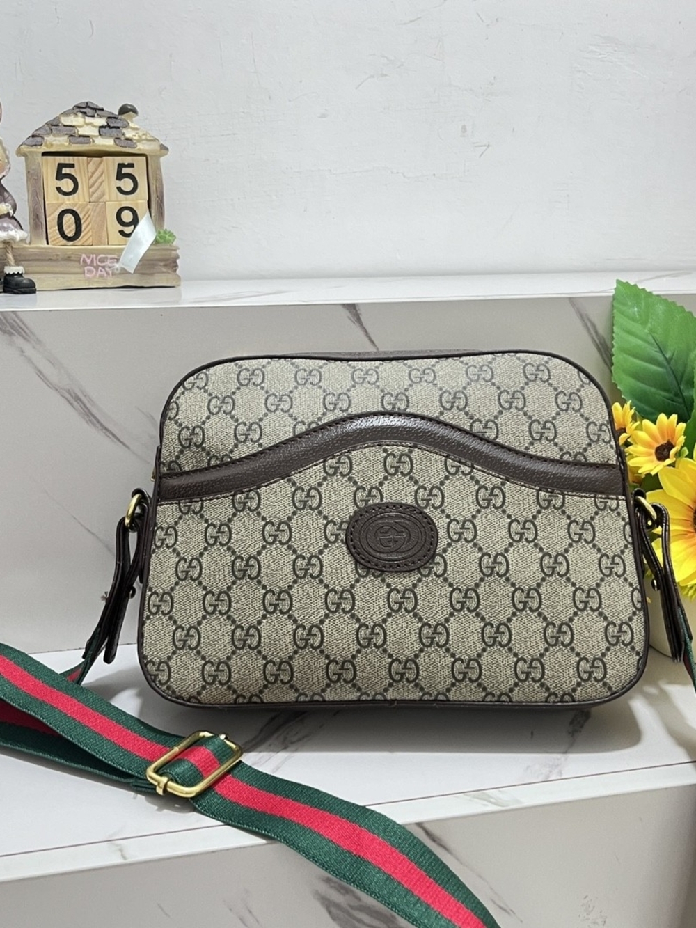 Beige Messenger Bag with Brown Trim and Green-Red Strap